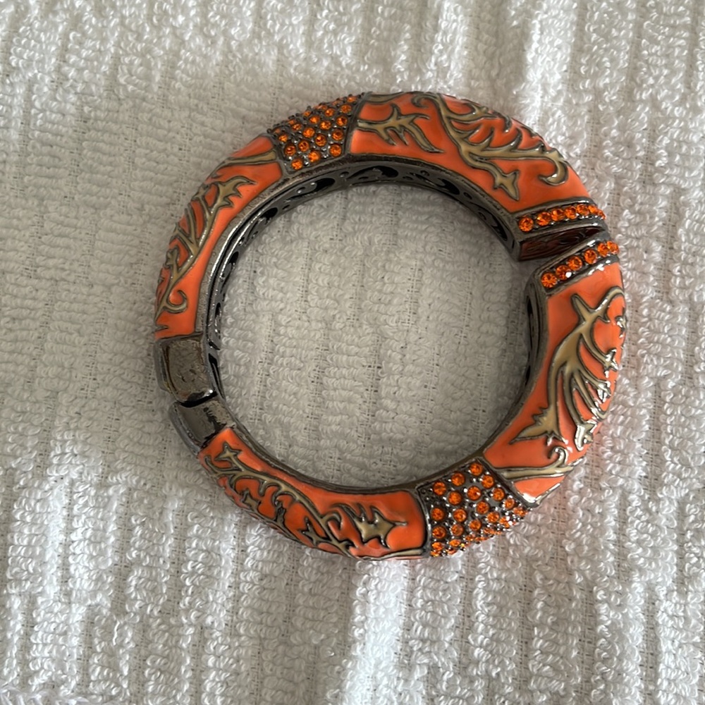 Fun orange bangle bracelet with sequins.